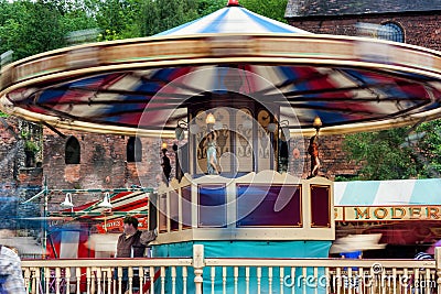 Victorian fairground carousel ride (Motion Blur) Editorial Stock Photo