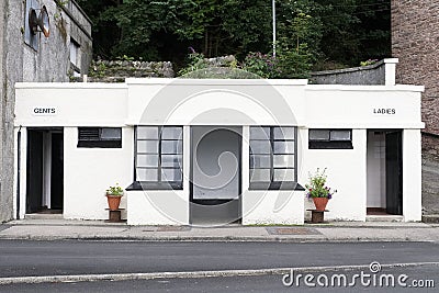 Victorian ladies and gents toilets Art Deco style white and black sign Stock Photo