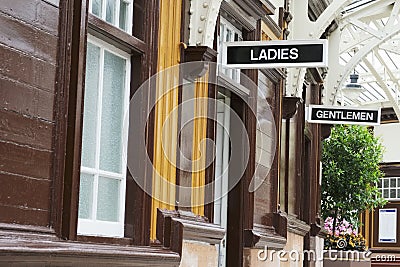 Victorian ladies and gents toilets Art Deco style white and black sign Stock Photo