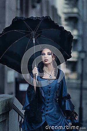 Victorian lady in blue Stock Photo