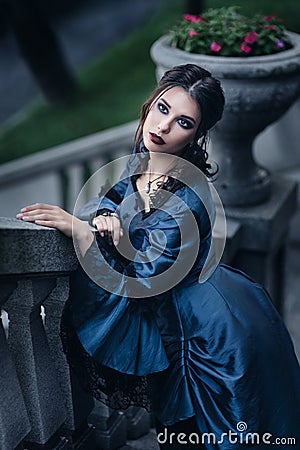 Victorian lady in blue Stock Photo