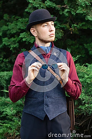 Victorian steampunk retro adwenturer guy in bowler hat Stock Photo