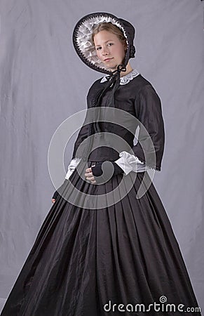 Victorian woman in black bodice. bonnet and skirt Stock Photo
