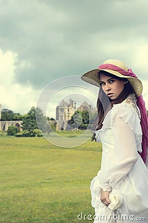 Victorian woman with manor house Stock Photo