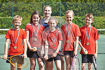 Victorious School Tennis Team With Medals Stock Photo