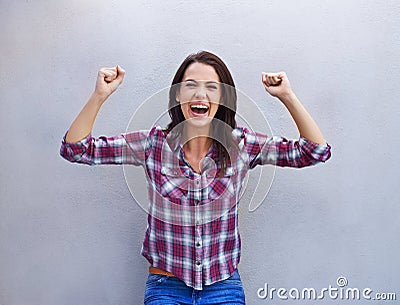 Victory is mine. an attractive young woman with her arms raised in celebration. Stock Photo