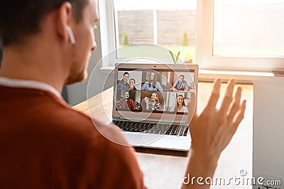 A guy is using laptop for video call, zoom Stock Photo