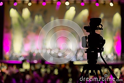 Video camera in background of concert, bokeh Stock Photo