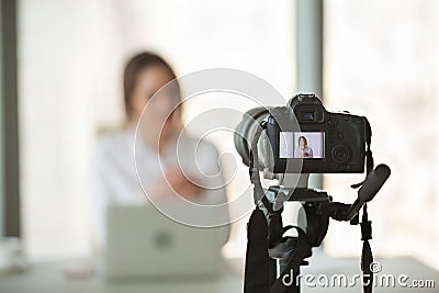 Video camera filming live training of successful business coach Stock Photo