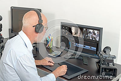 Video editor in his studio Stock Photo