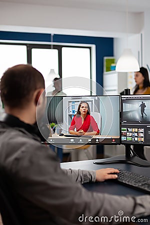 Video editor talking with remote customer in web online meeting Stock Photo