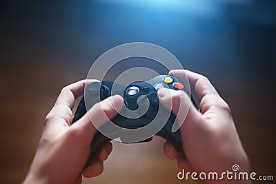 Video game controller in human hands, in front of the TV Stock Photo
