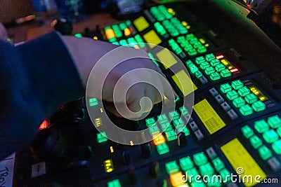 Video Operator makes adjustments on a professional broadcast television camera Stock Photo