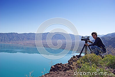 Video operator removes desert lake Stock Photo