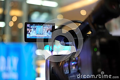 video production camera recording live event on stage. television social media broadcasting seminar conference Stock Photo