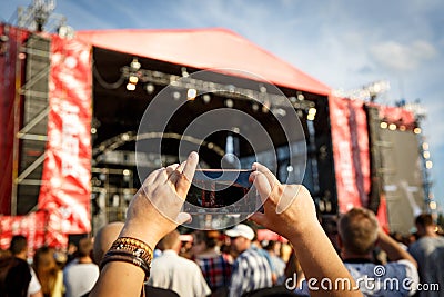 Video recording of the concert on the mobile phone. Editorial Stock Photo