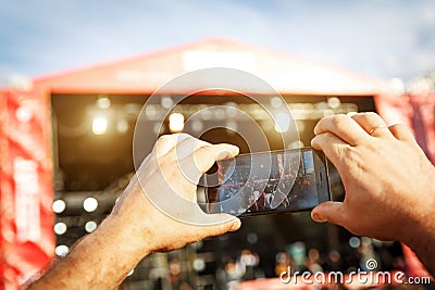 Video recording of the concert on the mobile phone. Editorial Stock Photo