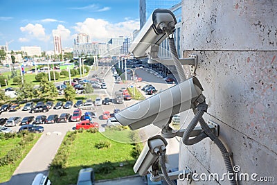 Video surveillance cameras on city wall Stock Photo