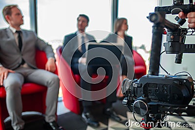 Videographer filming business meeting Stock Photo