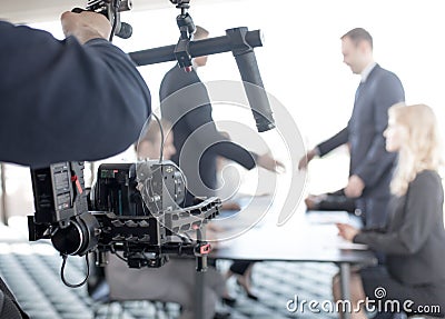 Videographer making video of business people Stock Photo