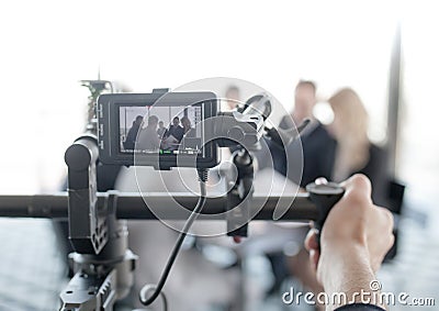 Videographer making video of business people Stock Photo