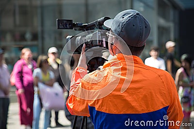 Videographer working street outdoor professional camera Editorial Stock Photo