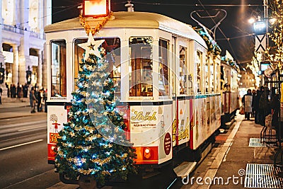 Viena, Austria - December 2017: Christmas decorated tram on the Editorial Stock Photo