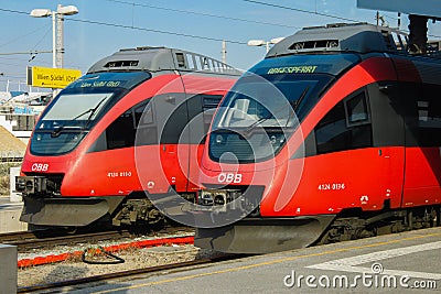 Vienna, Austria - 19 April 2012: Two red trains at Vienna South Station. Railway terminus Editorial Stock Photo