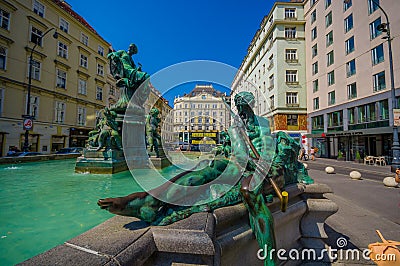 Vienna, Austria - 11 August, 2015: Very nice fountain with statues and beautiful green water located inner city, Graben Editorial Stock Photo