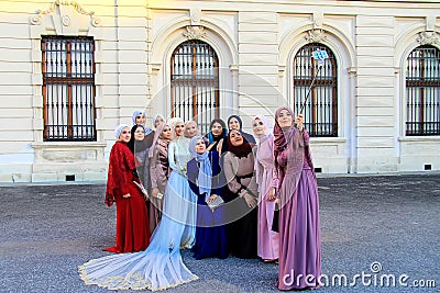 Vienna, Austria, Beautiful girls in Muslim clothes and wedding dress are photographed near the palace, Europe Editorial Stock Photo