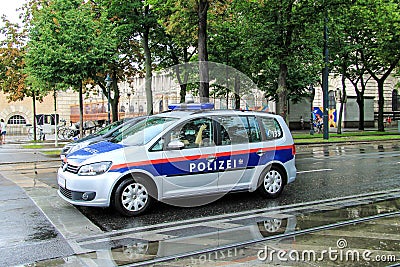 The car of Austrian Federal Police on the street of Vienna during the rain. Bundespolizei Editorial Stock Photo