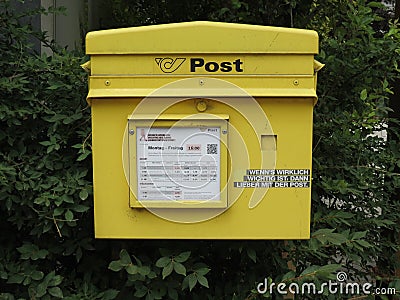 Yellow mail box for sending Editorial Stock Photo