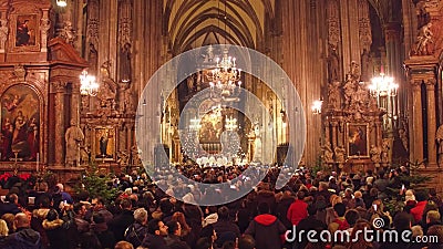 VIENNA, AUSTRIA - DECEMBER, 24 Christmas mass in Saint Stephen`s Cathedral. Popular touristic destination of the city Editorial Stock Photo