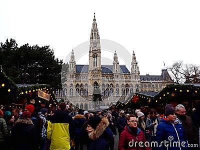 Tall gothic building of Vienna city hall Rathaus and traditional Christmas market Editorial Stock Photo