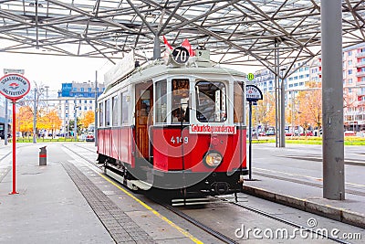Red retro tram `Vienna Ring Tram` at train station in Vienna Editorial Stock Photo