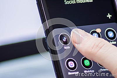 Vienna / Austria / November 14, 2020: Womanâ€™s thumb taping on the Tik Tok application on the smartphone Editorial Stock Photo