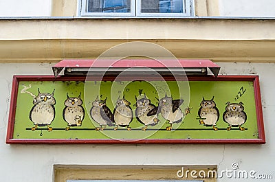 Architectural detail, shop facade with owls logo in Vienna, Austria Editorial Stock Photo