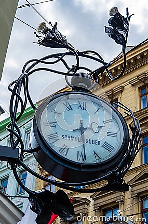 Architectural detail, street clock in Vienna, Austria Editorial Stock Photo