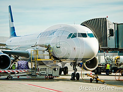 Vienna, Austria - September 17, 2012. Schwechat Airport in Vienna with parked airplanes Editorial Stock Photo