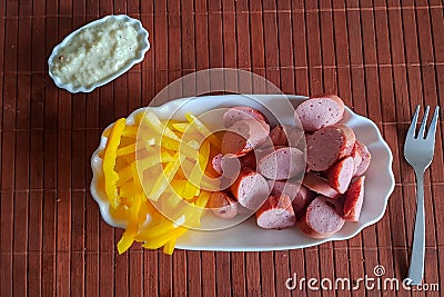Vienna sausages with pepper strips Stock Photo