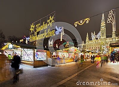 Vienna Town Hall and Christmas Market at night Stock Photo