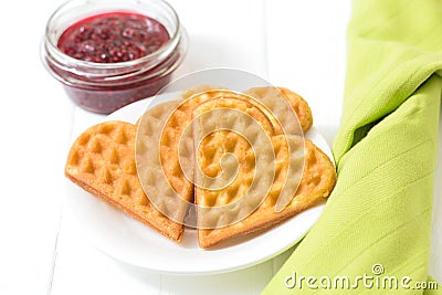 Viennese waffles, raspberry jam in a glass bowl on a white background Editorial Stock Photo