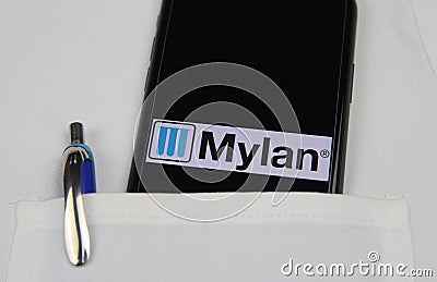 Close up of mobile phone screen with logo lettering of Mylan pharmaceutical company in pocket of white doctors coat with pencil Editorial Stock Photo
