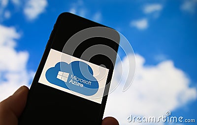 Closeup of smartphone with logo lettering of cloud computing provider service microsoft azure, blurred sky and cloud background Editorial Stock Photo