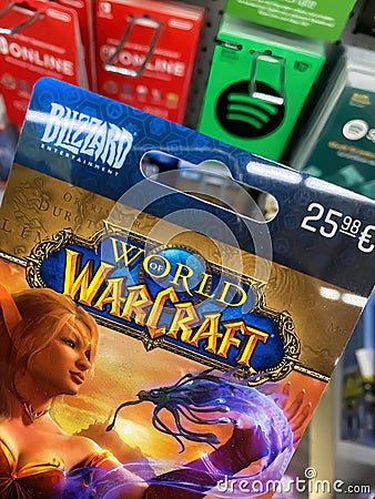 Closeup of world of warcraft voucher gift card in shelf of german supermarket focus on center of word warcraft Editorial Stock Photo