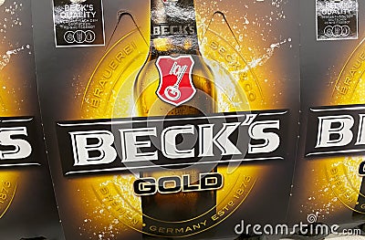 View on six pack Beck s gold beer in german supermarket Editorial Stock Photo