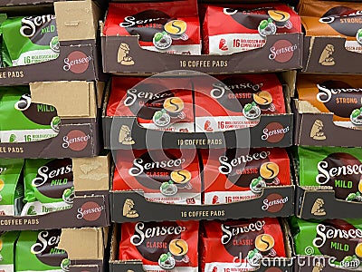 View on stacked boxes with Senseo coffee pads in german supermarket Editorial Stock Photo