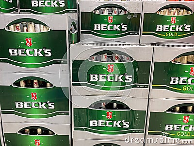 View on stacked green Beck s beer crates in german supermarket Editorial Stock Photo