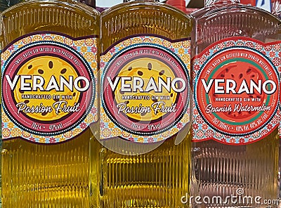 Closeup of bottles spanish verano fruit flavoured gin in shelf of german supermarket Editorial Stock Photo