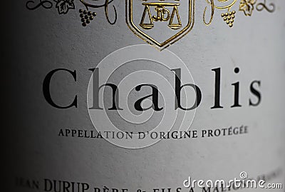 Makro closeup of isolated white wine bottle label with word text chablis Editorial Stock Photo